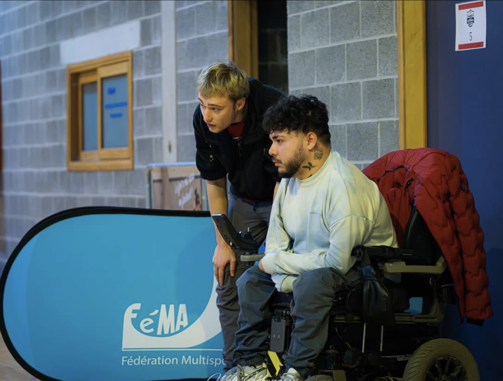 The alt text for the image is: "Pyramid of soccer balls stacked on a table."